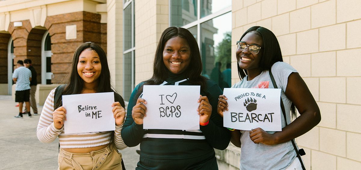 BCPS students holding signs supporting the school